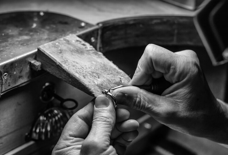 Hands of an artisan jeweler working jewelry. Jewelry Goldsmith